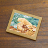 Note cards featuring a golden retriever on the rocky coast of New England by New Hampshire artist Hannah Phelps.