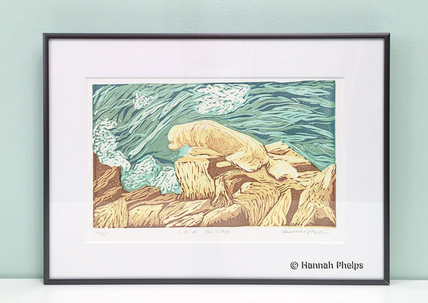 Framed jigsaw print of a dog on the rocky coast of Maine by New England artist, Hannah Phleps
