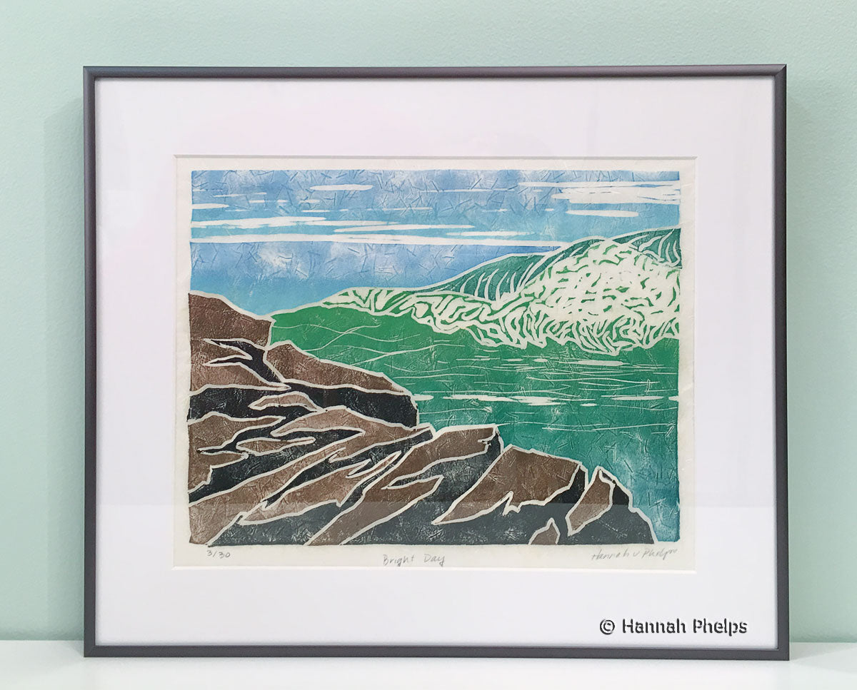 Framed jigsaw print of a wave crashing on a rock in Maine by New England artist, Hannah Phleps