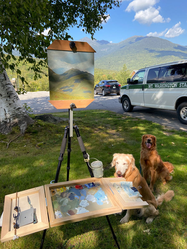 Dogs helping New Hampshire artist Hannah Phelps paint the White Mountains.